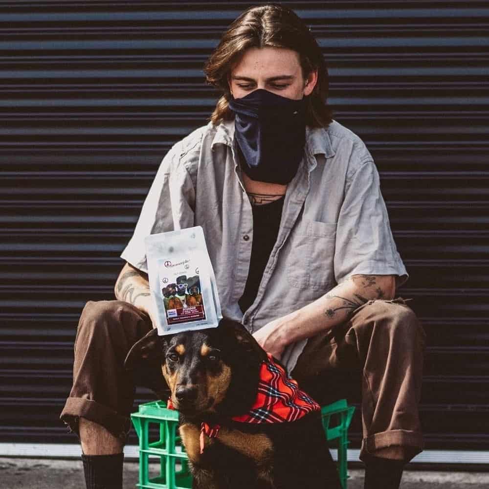 Man and his dog stand outside a dog friendly cafe in Melbourne