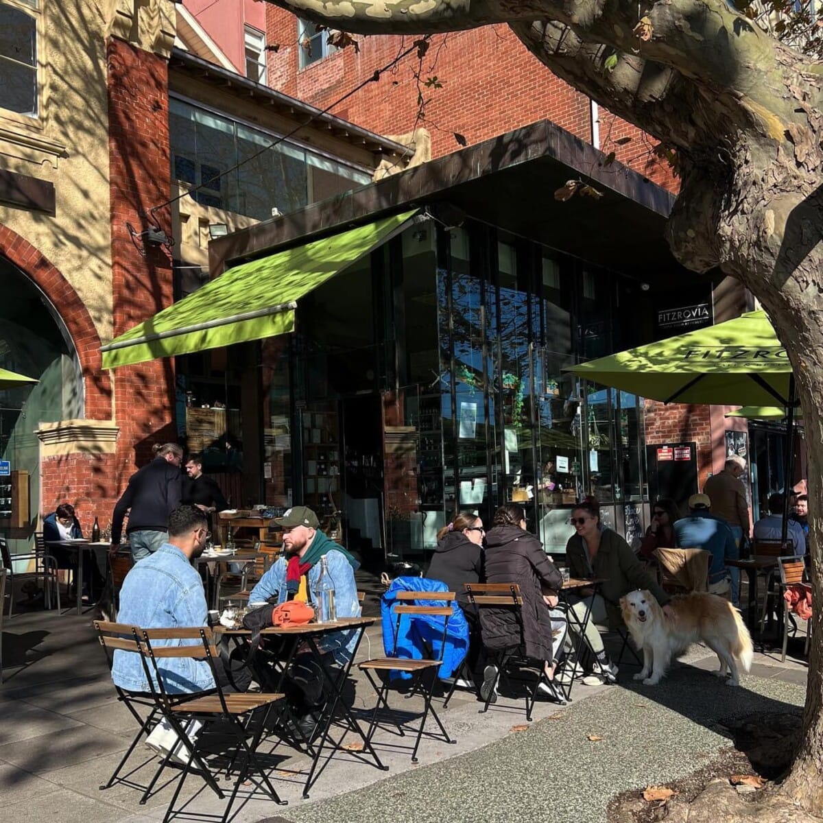 People enjoying their meal alfresco at this dog-friendly cafe in Melbourne
