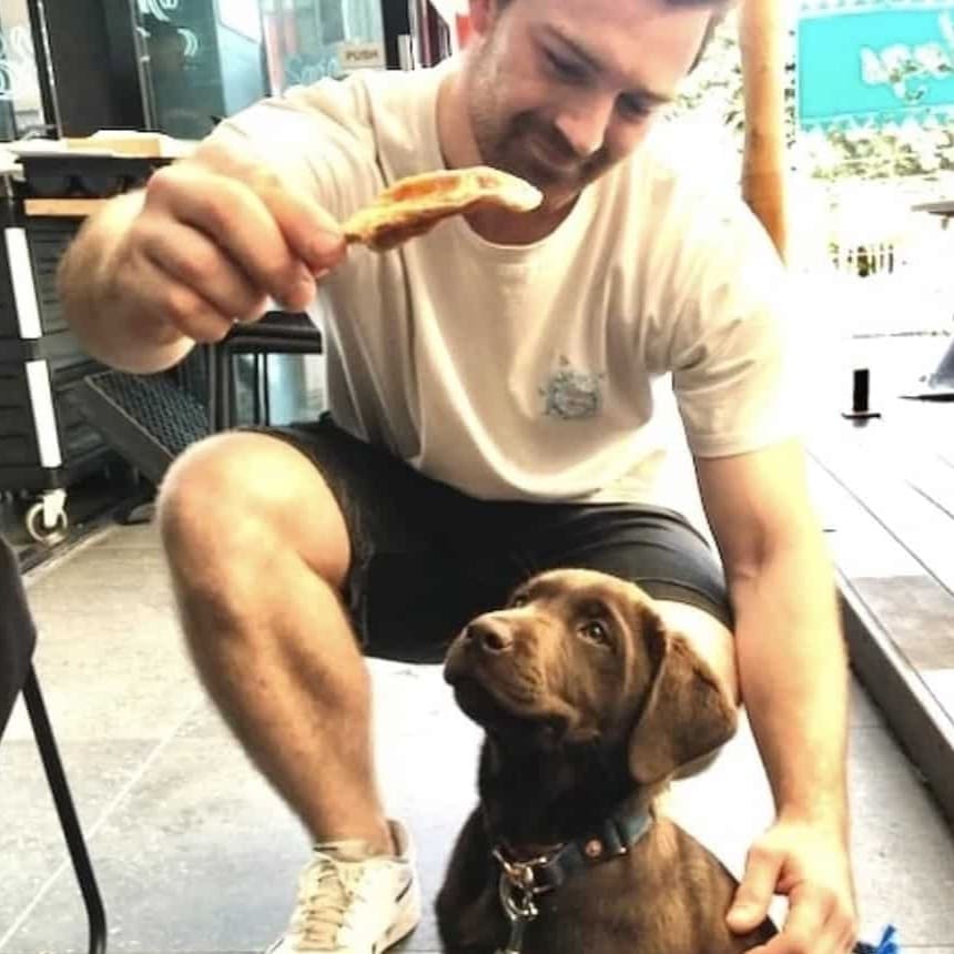 Adorable pup posing outside dog-friendly cafe in Melbourne