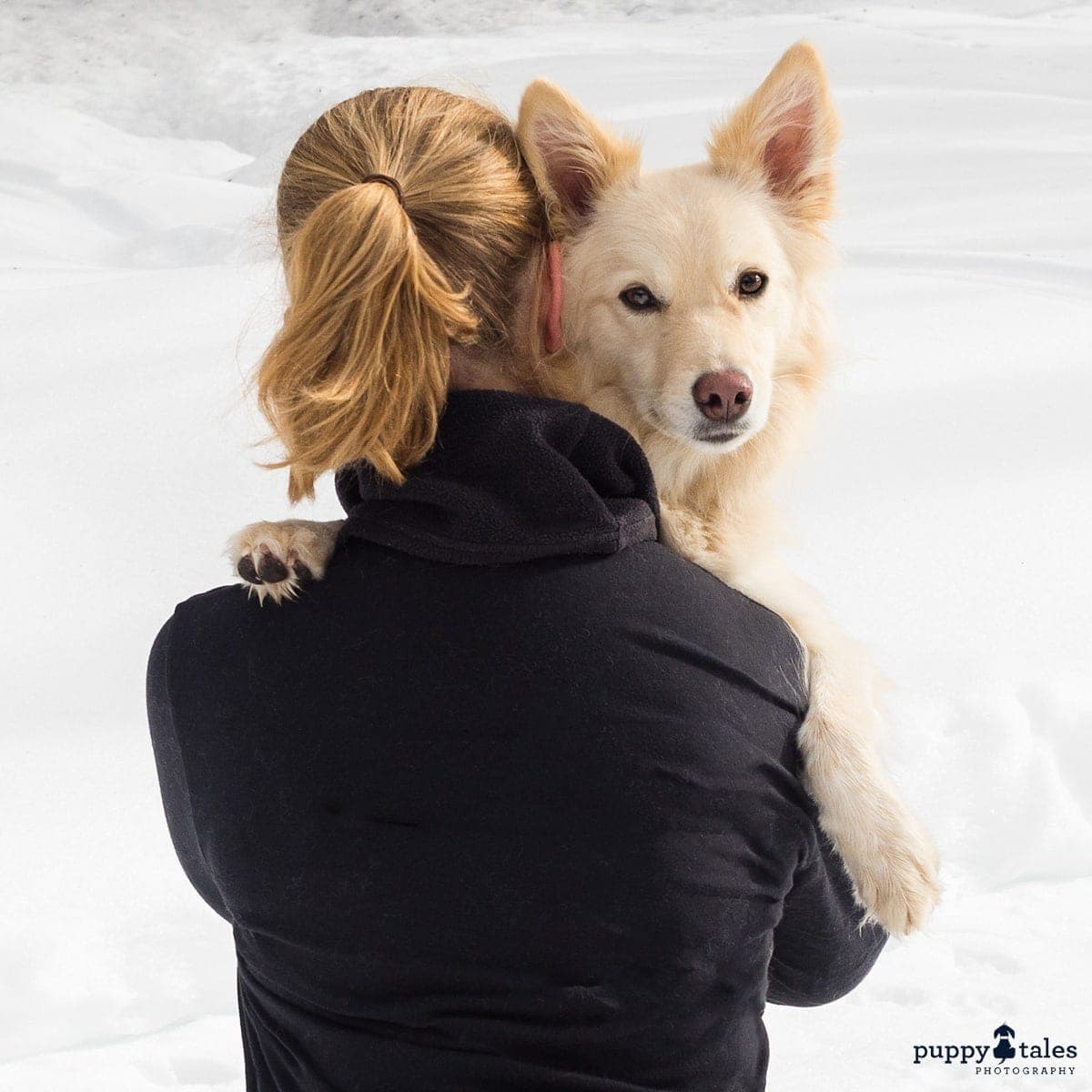 a woman cuddling her dog