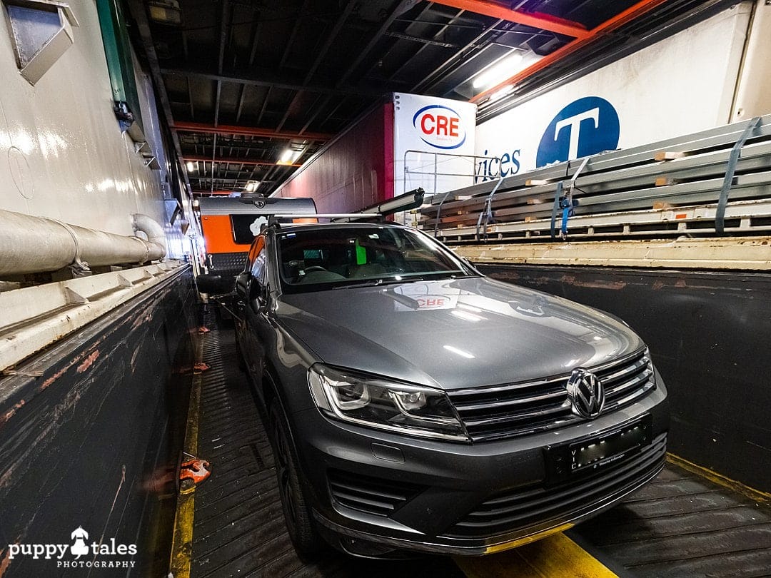 Vehicles and caravans parked inside the Spirit of Tasmania ferry when travelling